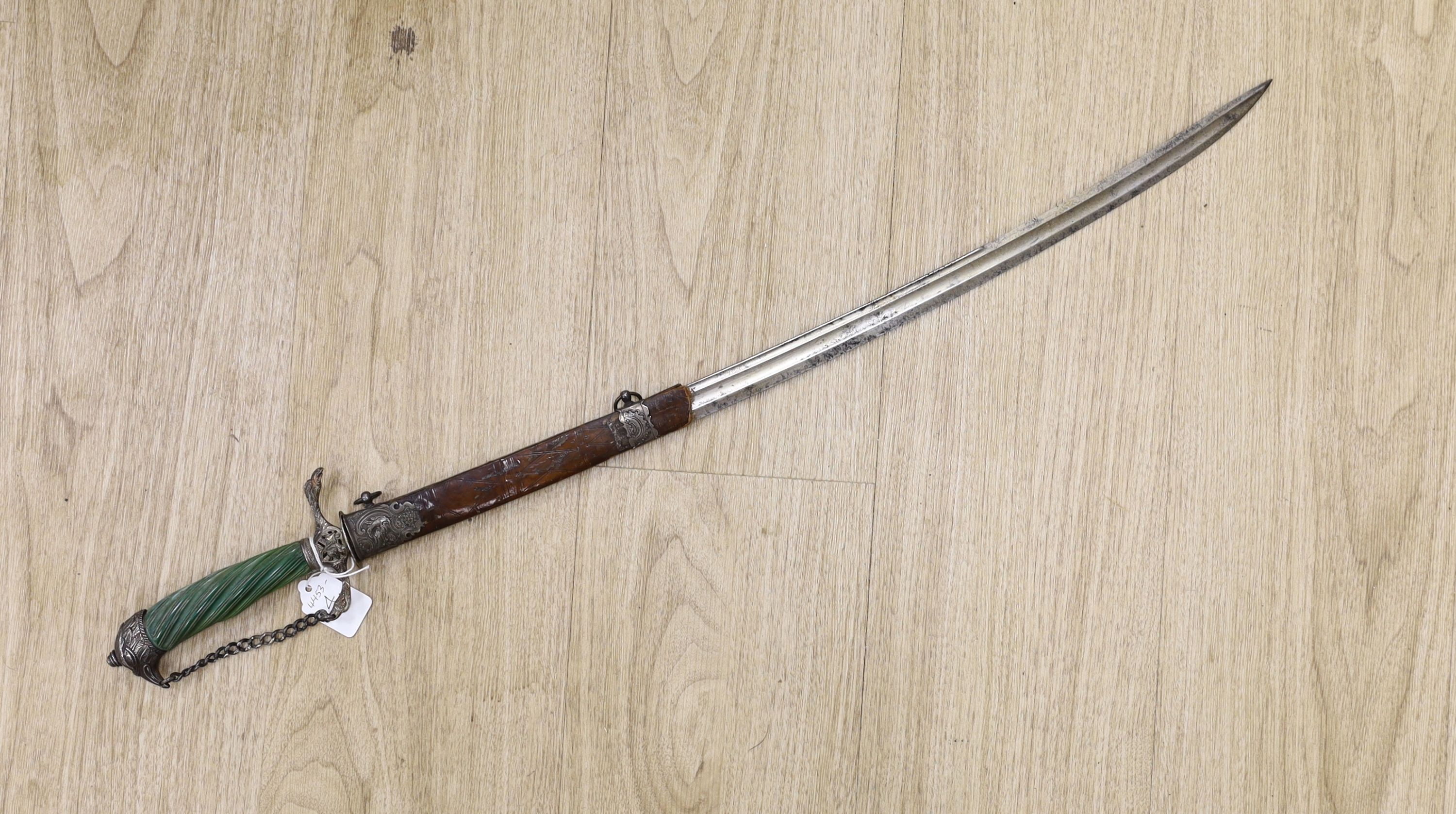 An English silver hilt hanger c.1770, London, maker M.B (year letter indistinct) eagle head pommel and crosspiece finials, spiral carved, green-stained ivory grip, curved fullered blade 63cms, retaining the top of its si